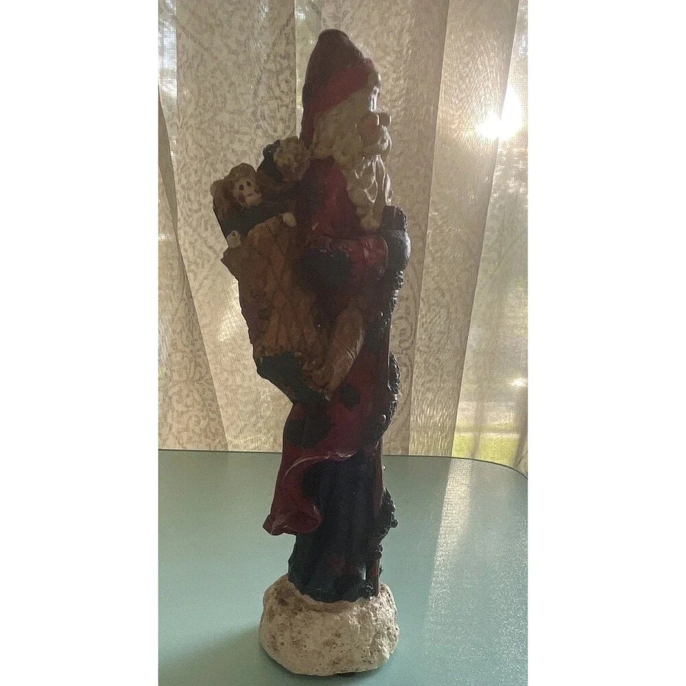 Vintage rustic, resin pencil Santa with toy bag